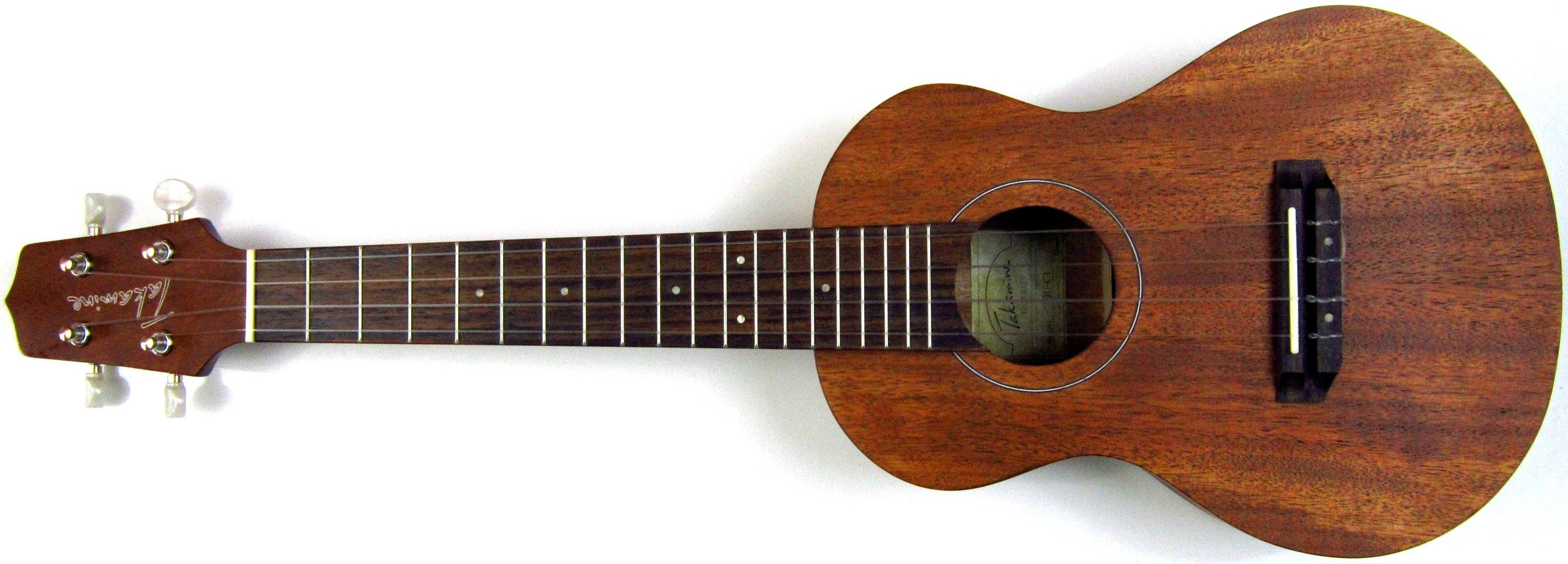 Un ukelele de concierto en horizontal: el clavijero a la izquierda, el mástil con trastes y la caja de resonancia a la derecha